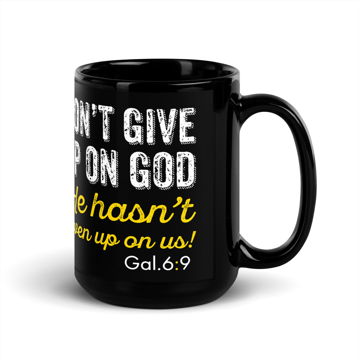 Angled view of a black Galatians 6:9 encouragement 15 oz mug, handle on right