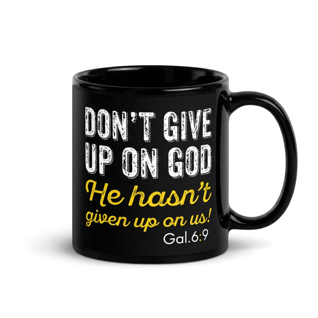 Black Don't Give Up on God 11 oz mug with white and yellow lettering, handle on right