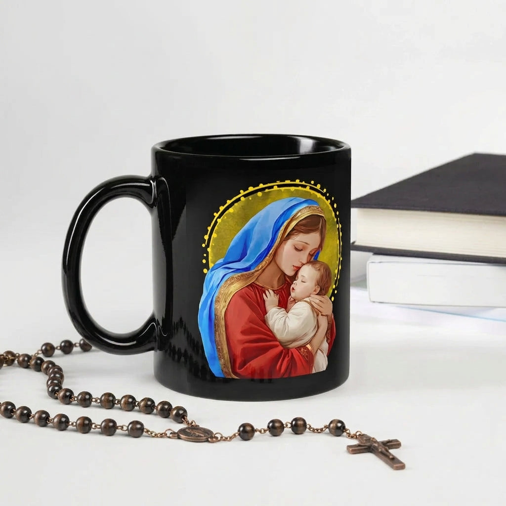 Black Mary and Jesus mug beside a rosary with a crucifix and stacked books, handle on the left
