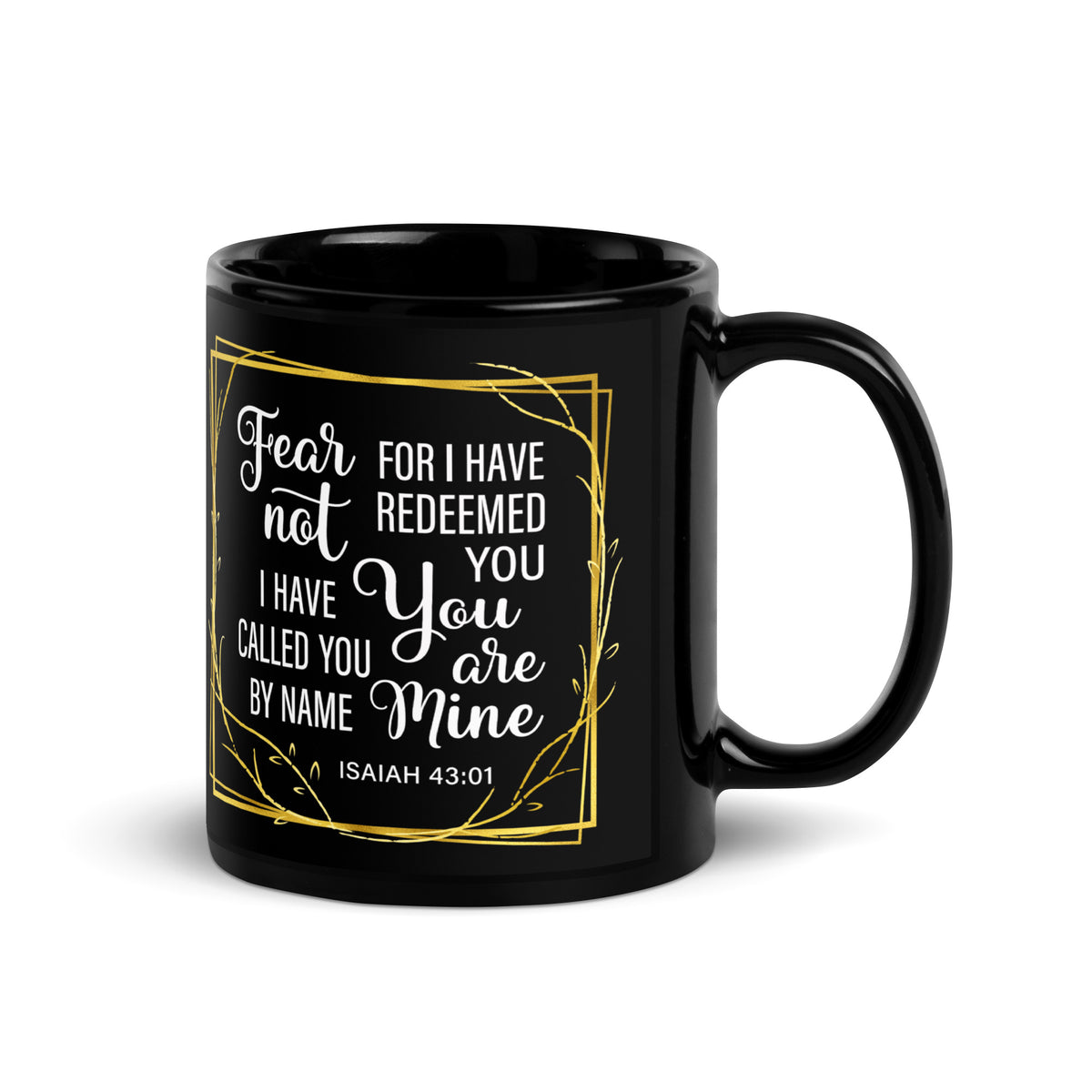 Black Isaiah 43:1 mug reading Fear Not and You Are Mine within a gold-colored border, handle on right