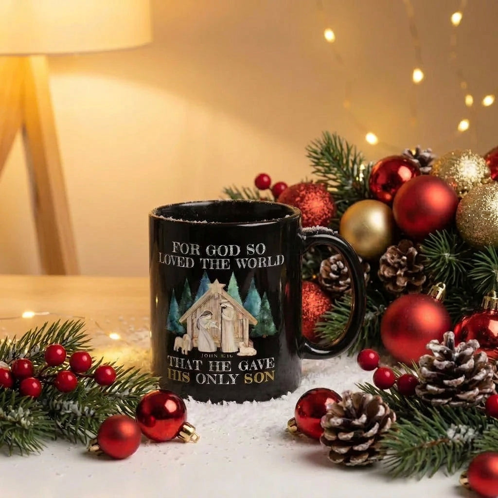 Black John 3:16 Christmas mug surrounded by red and gold ornaments, pinecones and evergreen