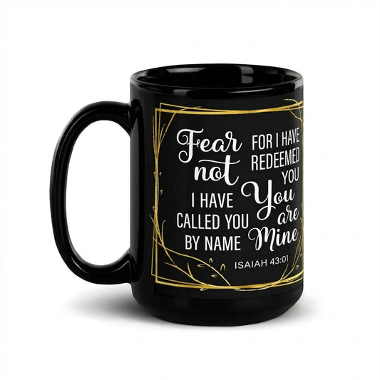 Black Fear Not Isaiah 43:1 mug with white lettering and a gold-colored leafy border, handle on left