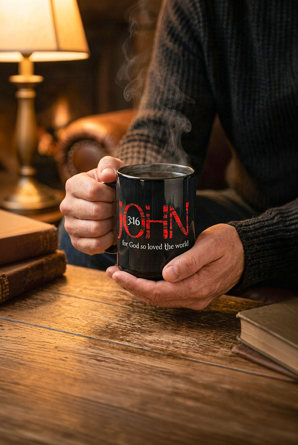 A man holding a Black 15 oz Christian mug with red and white John 3:16 design, handle on left