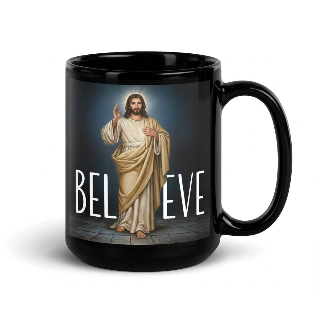 a black Believe 15 oz mug featuring Jesus in cream robes, handle on right