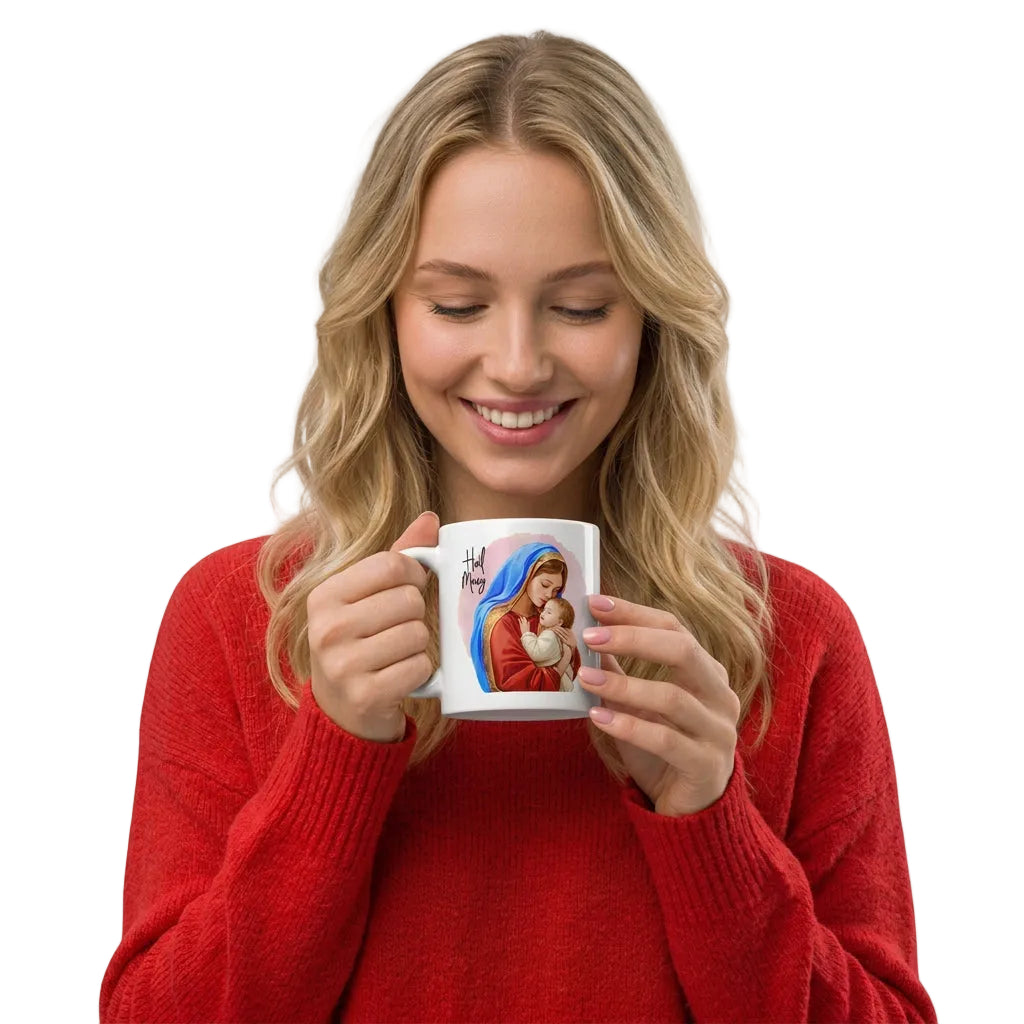 Smiling woman in a red sweater holding a white mug with Mary and Jesus artwork, handle on the left