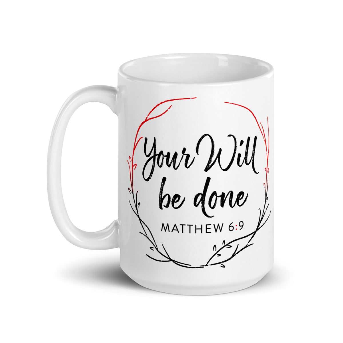 White Your Will Be Done mug with black lettering and a red-and-black botanical wreath, handle on the left