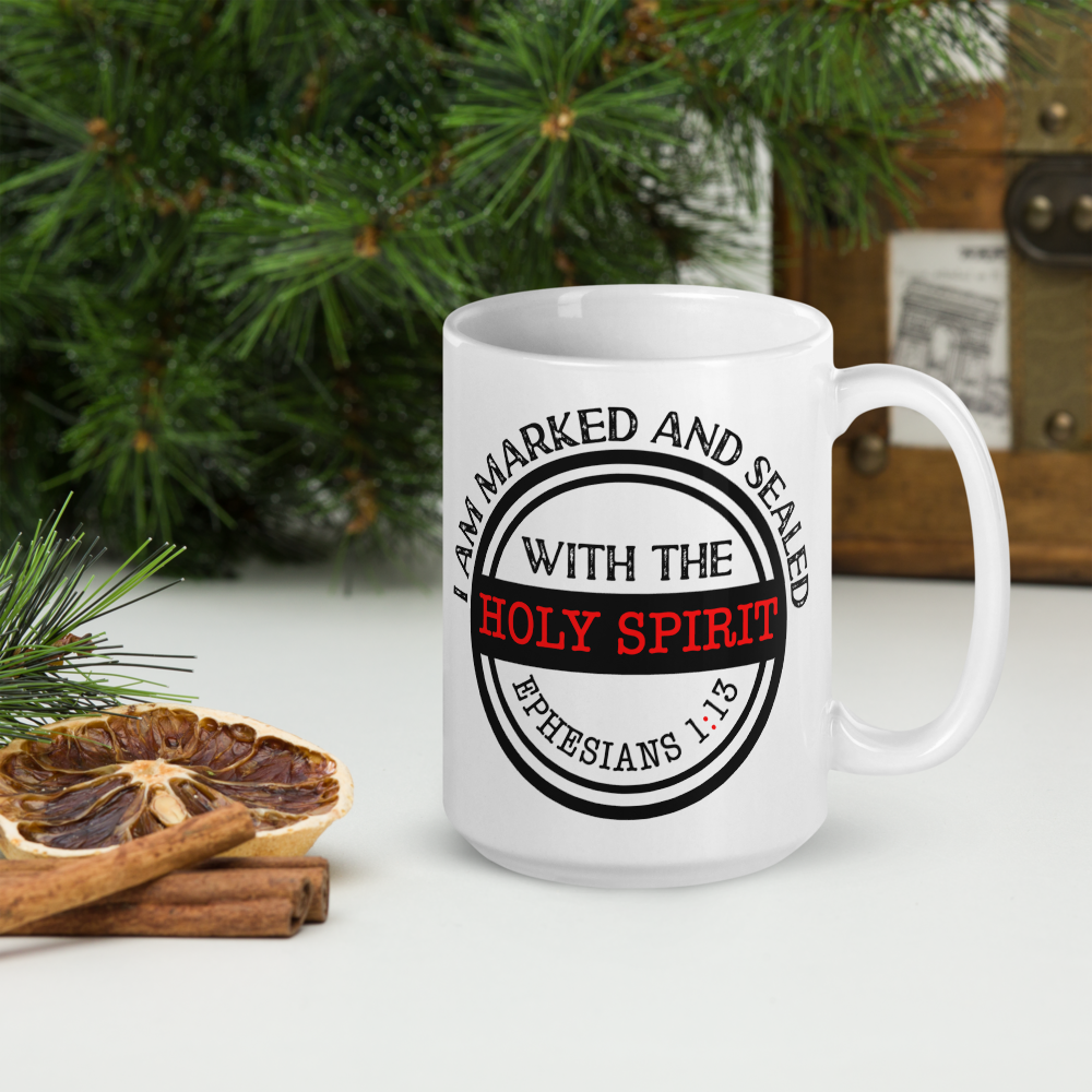 White Marked and Sealed Holy Spirit mug beside evergreen branches, dried citrus, and cinnamon sticks