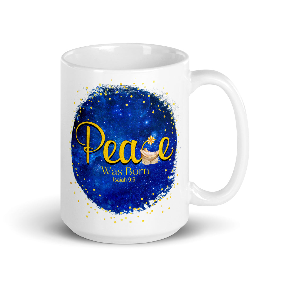 White mug with Peace Was Born Isaiah 9:6 lettering, a manger and star on a deep blue background, handle on the right