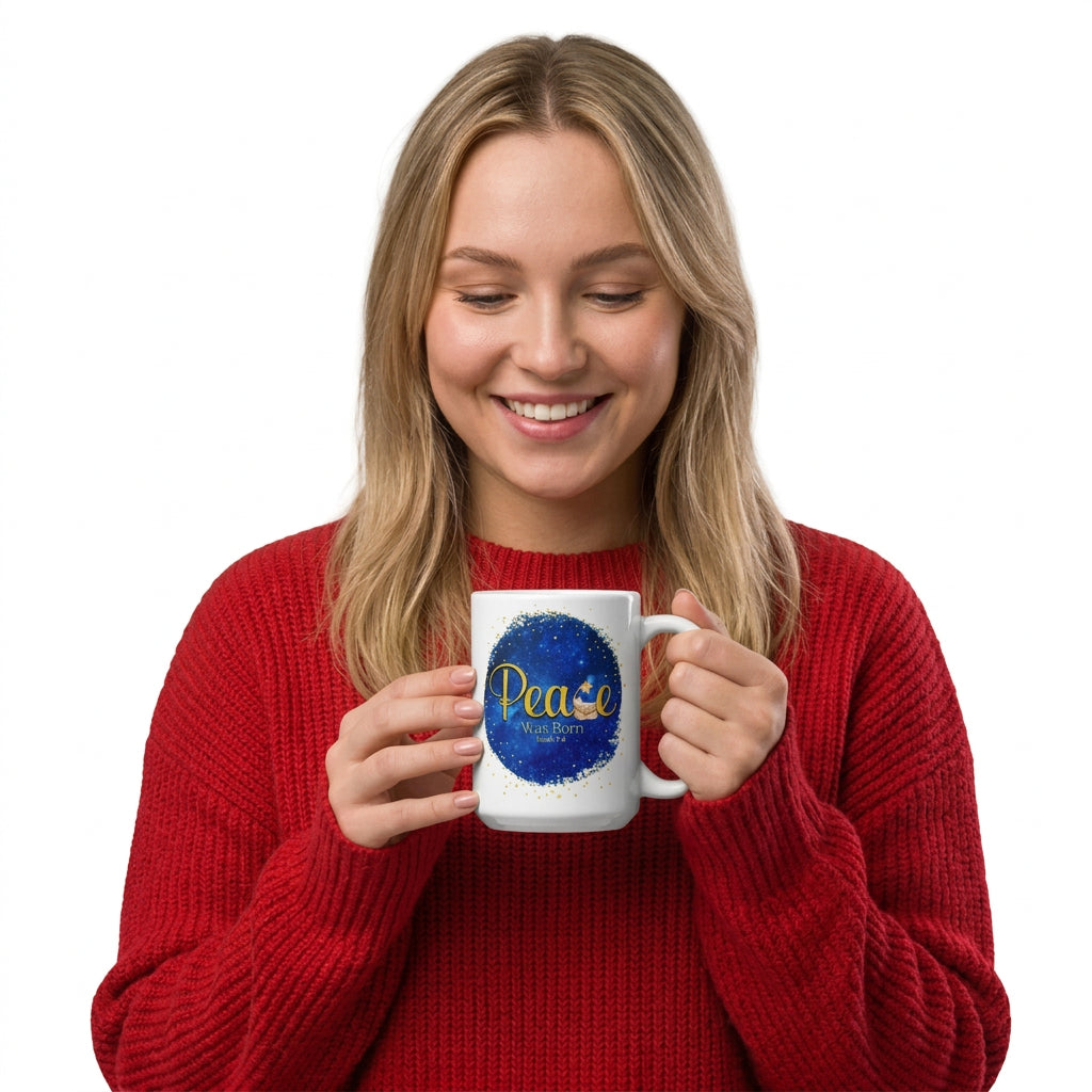 Smiling woman in a red sweater holding a white mug with the blue and gold Peace Was Born design, handle on the right