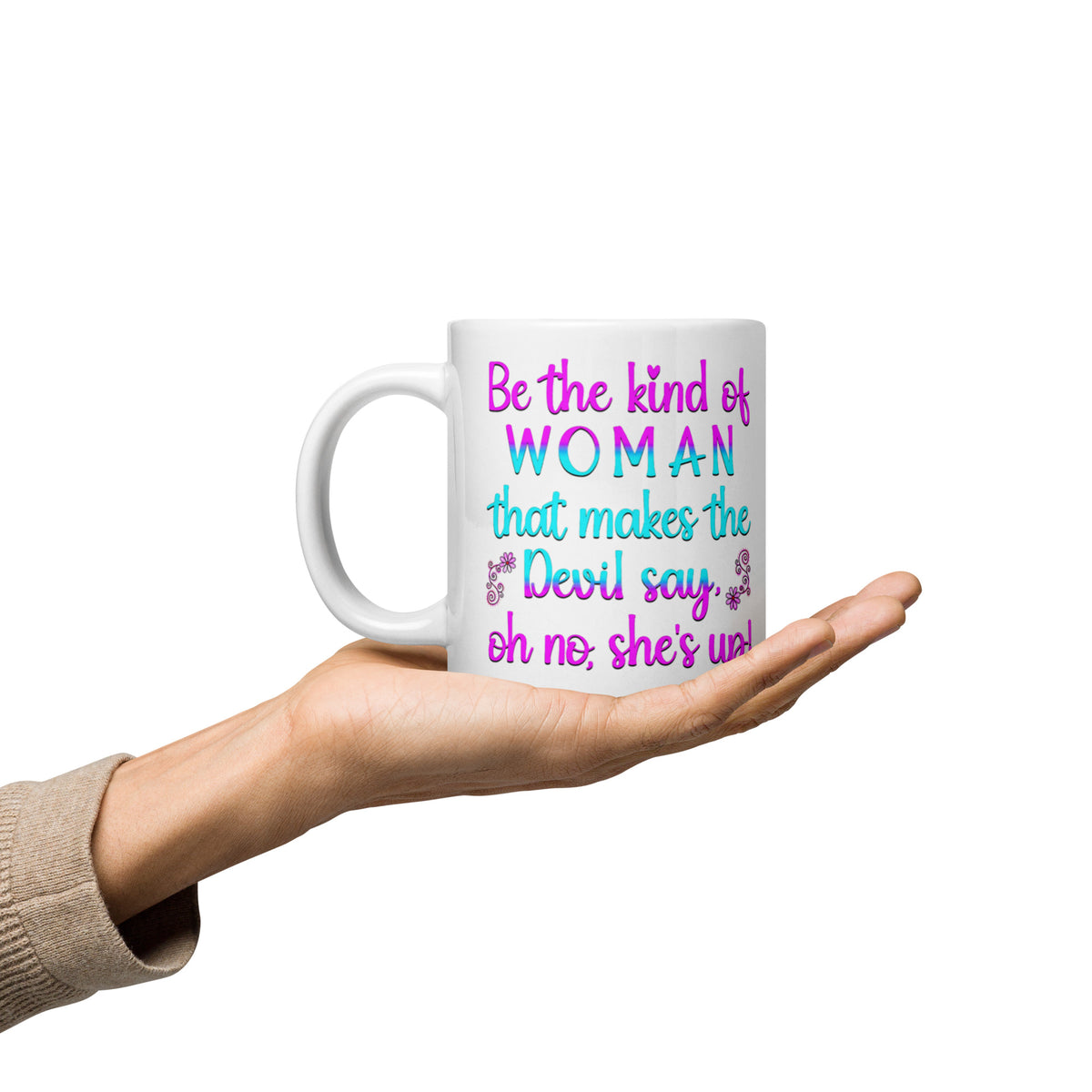 White Be the Kind of Woman mug resting on an open palm, handle on left